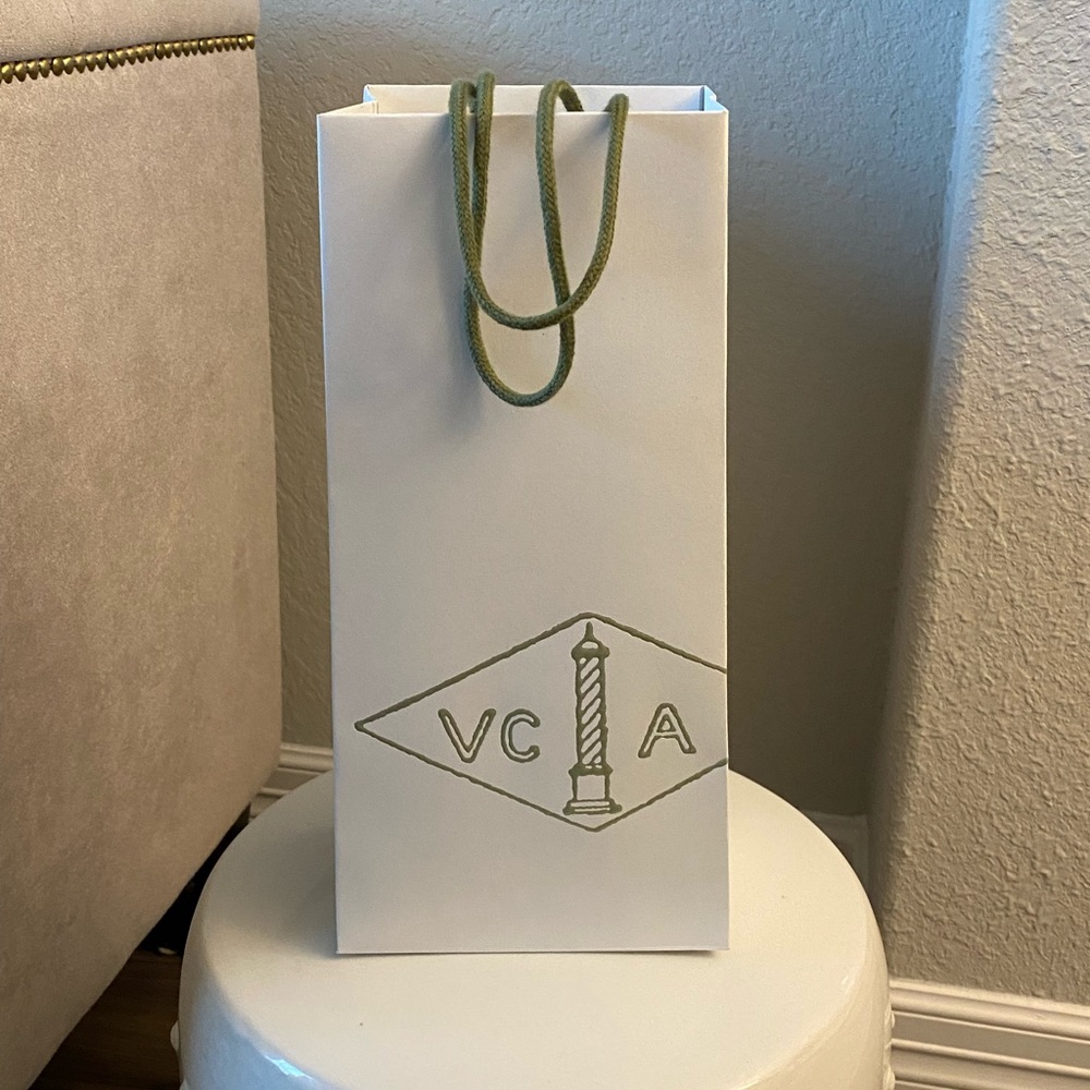 Authentic Van Cleef & Arpels paper bag.